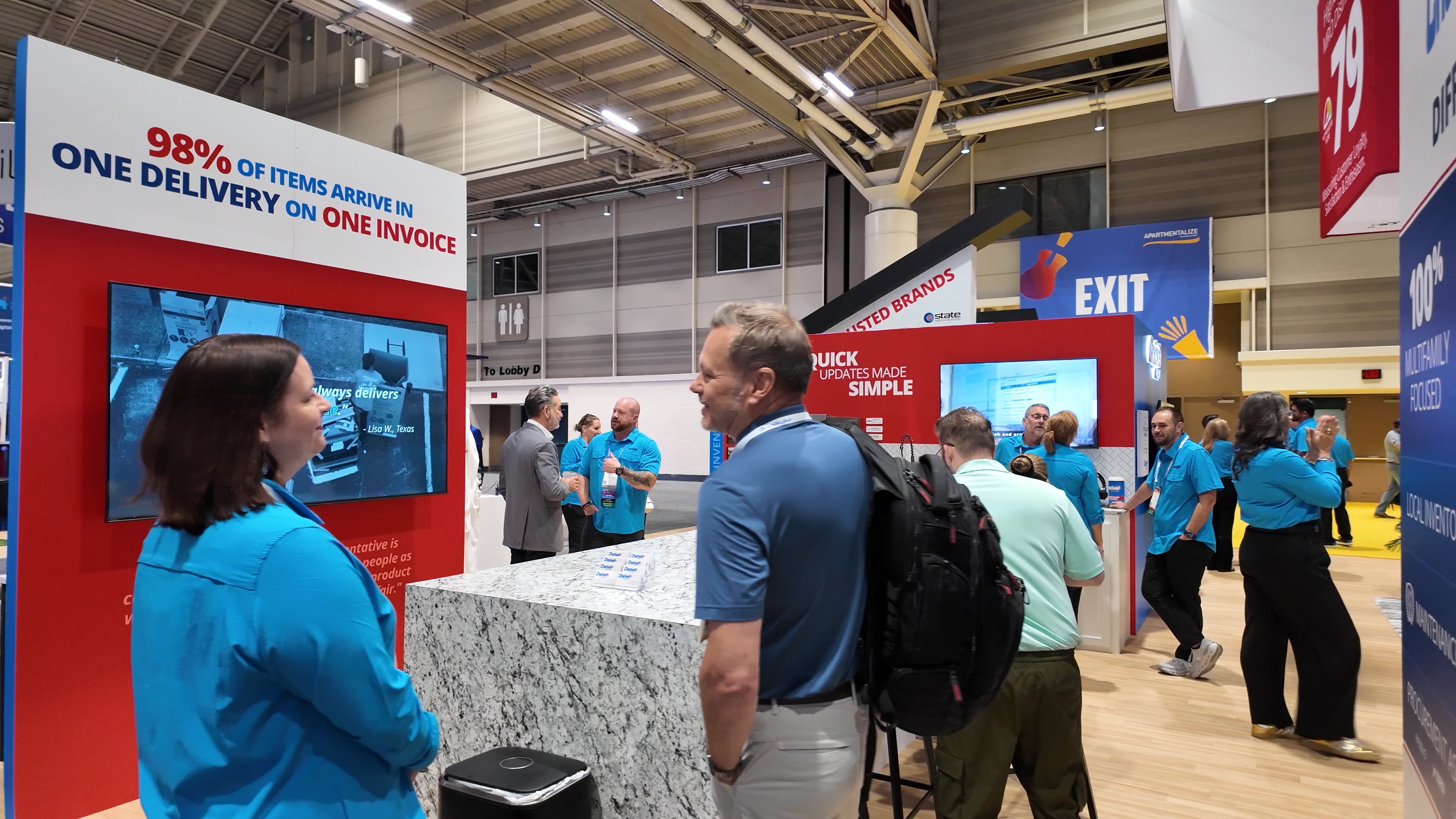 Chadwell Supply team member speaking with a visitor at the Apartmentalize booth